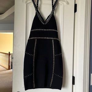 bebe Black body-con dress with gold rivets.